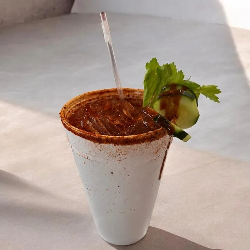 Chamoy-rimmed preparado drink with cucumber and celery