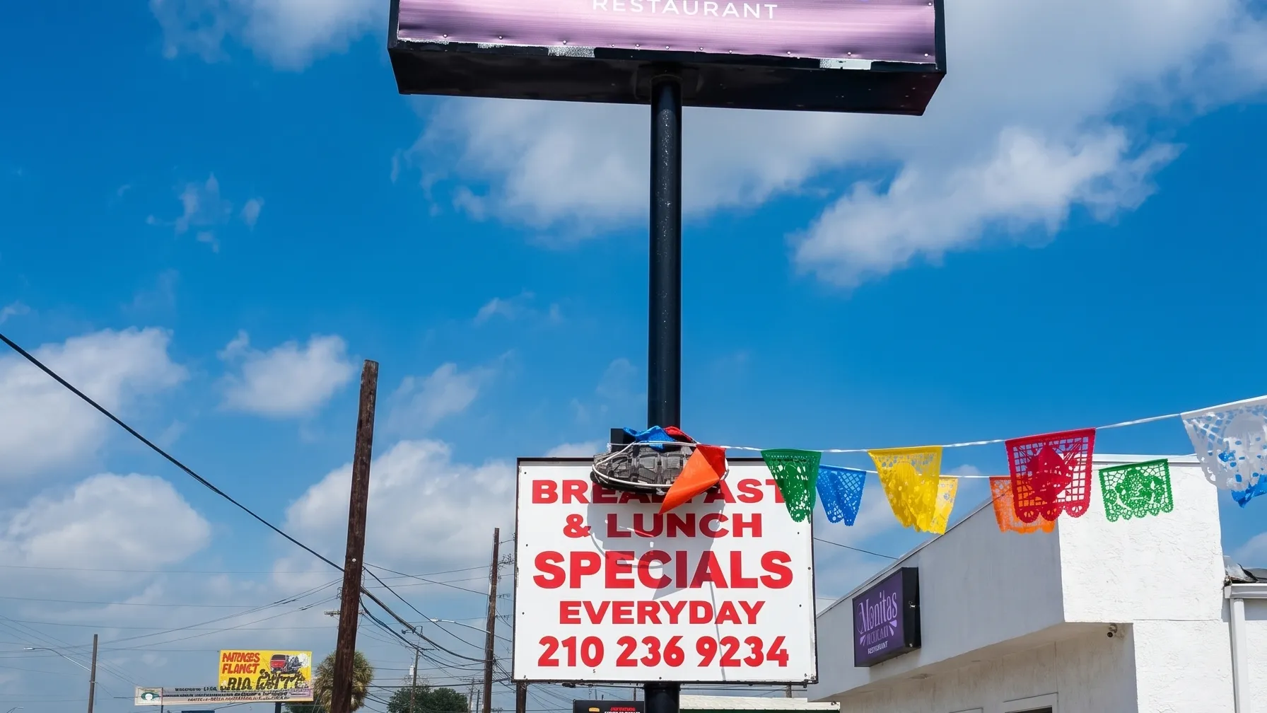 Tall Monitas sign with specials